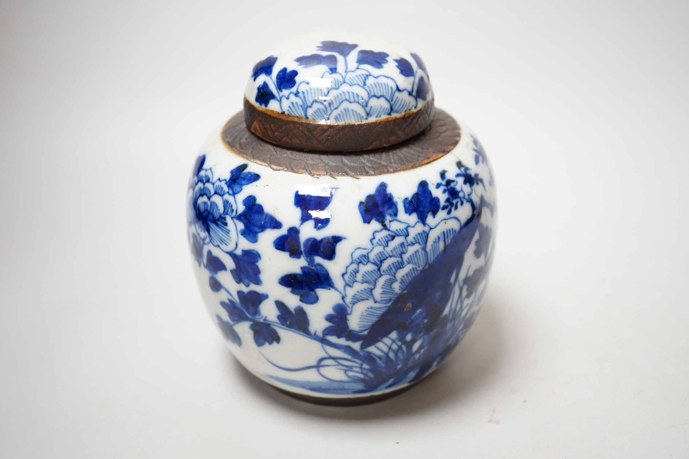 A Chinese famille rose plate, a cantonese plate and a blue and white crackle glaze jar